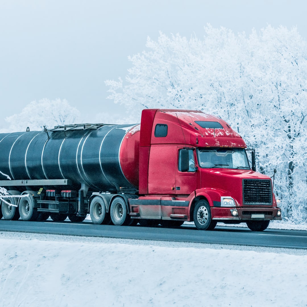 Semi Truck Driving Through Snow